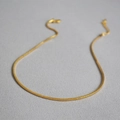 Elegant gold snake bone chain necklace with smooth minimalist metallic texture - Gold