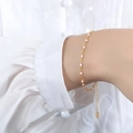 Elegant gold chain bracelet for women featuring pink enamel accents and adjustable link - Bracelet / Pink