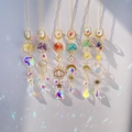 Golden Tree of Life crystal suncatchers with natural stones and prism pendants hanging - Multicolor Tree of Life
