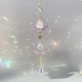 Crystal suncatcher with raw rose quartz and amethyst stones creating rainbow reflections - Amethyst / Purple