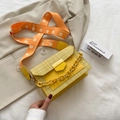 Yellow woven tweed crossbody bag with orange daisy pattern wide shoulder strap - Yellow