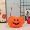 Halloween pumpkin candy bag made of orange felt with a black smile face design - Pumpkin Bag A