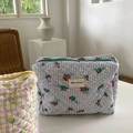 Quilted floral makeup organizer with blue grid pattern and green zipper closure - Blue Plaid Floral