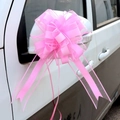 Pink ribbon bow made of organza and silk attached to a white car mirror for decoration - Elegant Pink