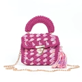 Detail of hand-woven colorful bag showing fuchsia texture, gold lock, and chain strap - Fuchsia Patchwork