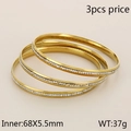 Three-piece gold-tone stackable crystal-inlaid stainless steel bangles with 68mm diameter - 3-Piece Gold Rhinestone Bangle Set (KB103102-LO)