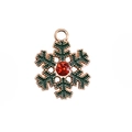 Golden snowflake charm with dark green enamel and faceted red gemstone center - No.39 Heart Snowflake
