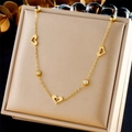 Elegante gouden roestvrijstalen ketting met holle hartjes en glinsterende kristallen bedels - Ketting (N2764)