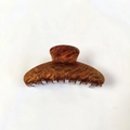 Detail showing the brown tortoiseshell pattern on a large hair claw clip for women - Dark Brown