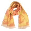 Detailed view of winter scarf with orange floral jacquard patterns and soft frayed edges - Yellow Orange