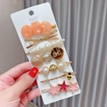 Detail of 8-piece pearl hair clip set featuring resin stars and golden bee charms - 7pcs Set-Orange Shell Style
