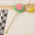 Cute watermelon plush massage stick with green wood handle on a woven mat - 35cm (Massage Stick) / Watermelon
