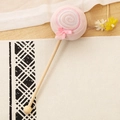 Pink lollipop plush massage stick with wooden handle on a woven mat - 35cm (Massage Stick) / Pink Candy