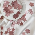 Stelle glitterate color oro rosa per decorazioni di nozze su piatto bianco - Stella Oro Rosa