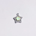 Silver star pendant featuring white rhinestones and a pale yellow flower center detail - Green