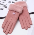 Close-up of pink faux suede winter gloves with fluffy fur cuffs and leather fashion label - One Size / Pink (Center Line)