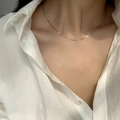 Elegant minimalist silver snake bone chain necklace worn on model for a sleek look - 1.0 Round Snake Chain Necklace (Steel Color)
