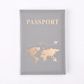 Detailed close-up of grey PU leather passport holder with golden world map stamping - Gray
