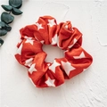 Red velvet scrunchie with white star pattern for Christmas hair styling - Red Stars
