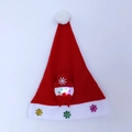 Detail of red Christmas hat featuring a glowing LED snowman and snowflake appliqués - Adult Glow Snowman