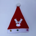 Close-up of glowing reindeer nose and glittery snowflakes on kids Christmas hat - Adult Glow Reindeer