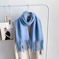 Thick light blue faux cashmere scarf with long tassels paired with beige coat - Haze Blue