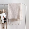 Detail of white knit scarf with thick fringe tassels and soft mohair texture - White