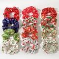 Set of 12 Christmas satin hair scrunchies with holiday patterns like trees and snowflakes - 12 Pieces Pack (Multi-color)
