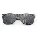 Macro detail of black matte pinhole glasses featuring a dense array of fine corrective holes - Premium Black Full-Hole