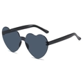 Chic heart-shaped sunglasses with black lenses and glossy frames in a 45-degree side view - Black Gray