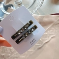 Detail of dark green hair clips with gray crystal hearts and gold France lettering - Heart Style Dark Gray Pair