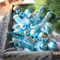 Blue Christmas ornaments set with mixed textures including ball and sock shapes on snow - Blue Series Multi-Shape Combination (Q-A02-41)