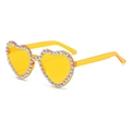 Detailed view of yellow heart-shaped sunglasses with colorful rhinestones on a white base - Orange Lens Colorful Rhinestones