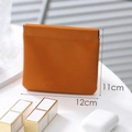 Mini orange PU leather makeup pouch with squeeze closure and embossed Eternity text - Large Caramel
