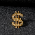 Macro detail of gold dollar sign ring with sparkling crystals on black texture - Gold Ring