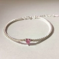 Dettaglio del bracciale tennis in argento S925 con zircone cuore rosa e chiusura regolabile - Rosa (Zirconia Rosa con Piastrina)