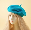 Classic teal faux cashmere beret hat for women shown on a mannequin head model - One Size / Lake Blue