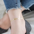 Gold snake chain anklet for women made of durable stainless steel shown on ankle - B87 4mm Blade Chain