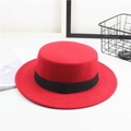 Close-up of red felt flat top hat featuring a stylish black decorative ribbon band - One Size / Square Ribbon / Red