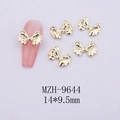 Macro shot of 14x9.5mm gold metal bow nail charms showing details and MZH-9644 size - Gold Bowknot-9644
