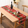 Close-up of red Christmas table runner with knitted tree patterns and festive tassels - Knit Christmas Tree Style