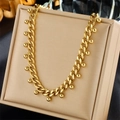 Chunky gold titanium steel chain necklace with small beads on a jewelry display box - Gold Bead Cuban Chain Style (N2266)