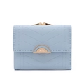 Detail of light blue faux leather wallet featuring V-shaped quilting and leaf metal clasp - Blue