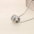 Macro detail of silver stainless steel pendant with roman numerals and sparkling rhinestones - Roman Numeral Cylindrical Style (KN237976-GC) / Steel
