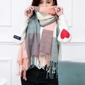Pink and grey checkered faux cashmere scarf with fringe details worn by a model - Pink and Green Plaid