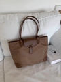Large capacity commuting nylon tote bag with brown leather flap detail and sturdy dual handles. - Dark Brown