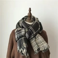 Thick black and white plaid scarf with tassels on a mannequin for autumn and winter - Double Sided Black Rice