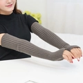 Close-up of dark brown ribbed knit arm sleeves with fingerless design for autumn - One Size / Dark Gray