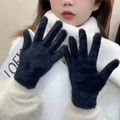 Close-up of black faux fur winter gloves showing plush texture and five-finger design - Black