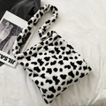 Plush faux fur cow print tote bag for women with spacious single shoulder strap design - White